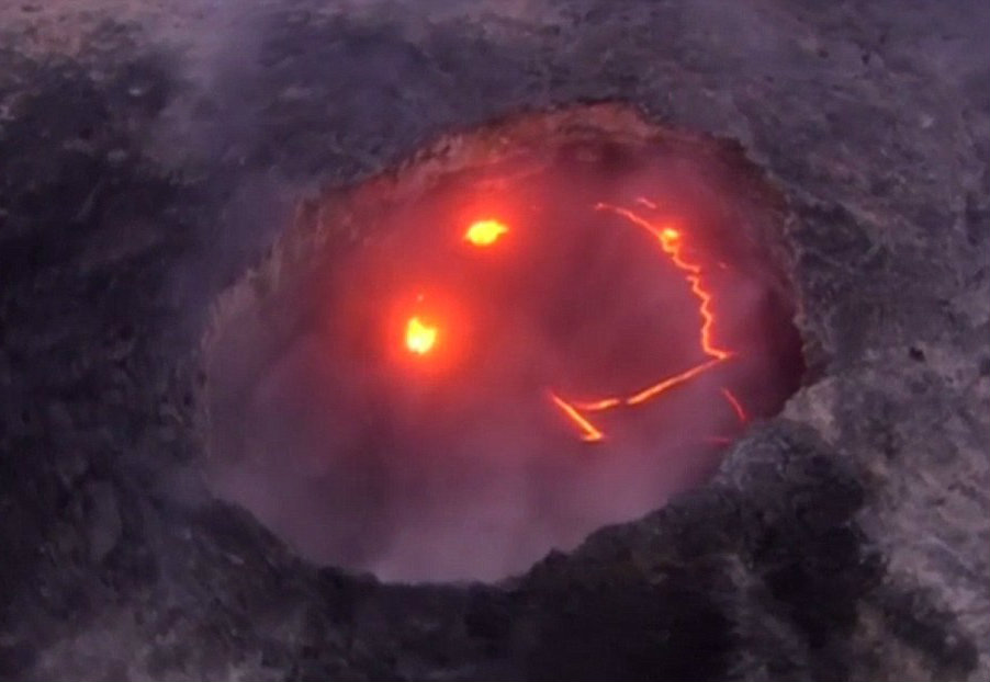 Interestingly enough, the Kilauea volcano has shown a lighter side than most volcanoes given the smiley face made by hot lava appearing at the top. Image Credit: Daily Mail