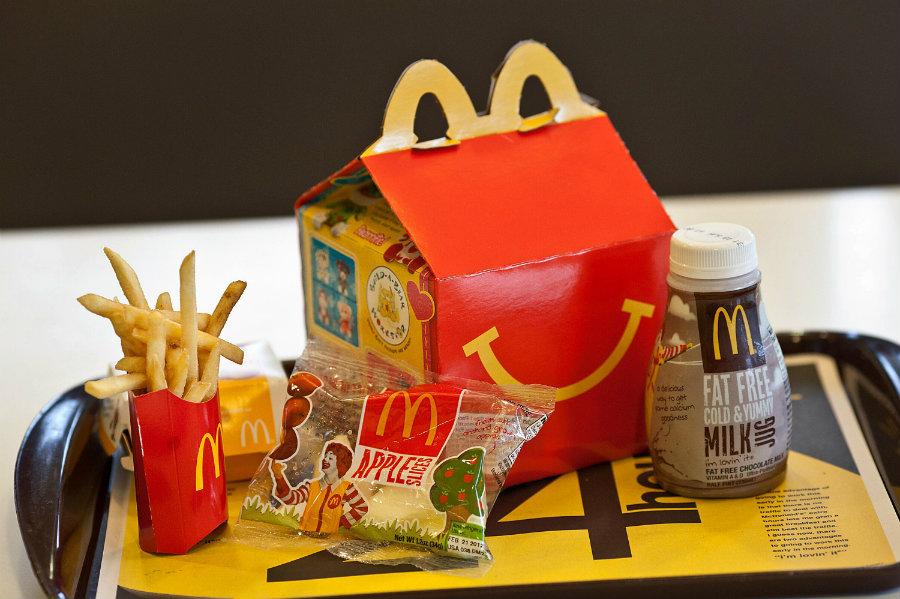 The initiative was highly criticized since it mixed in the same Happy Meal Box a fitness tracker alongside chicken nuggets, burgers, and fries. Photo credit: Cupure