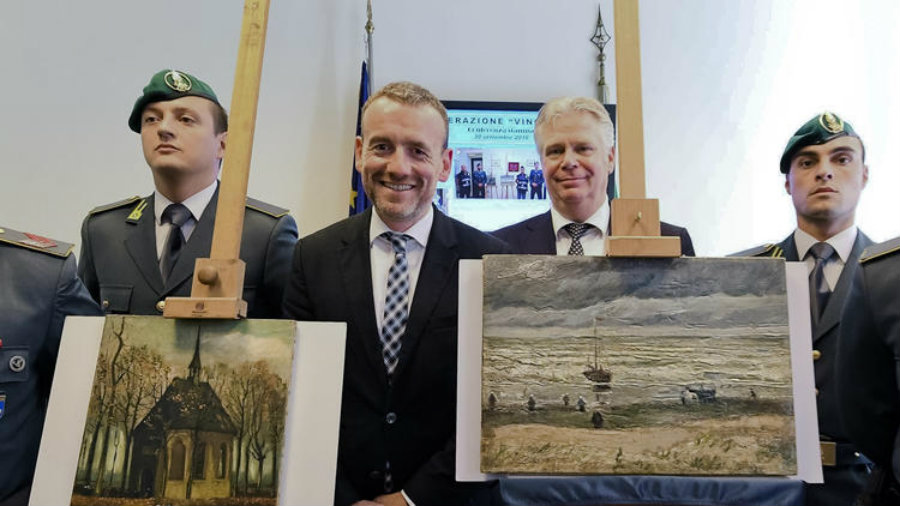 The paintings are “Seascape at Scheveningen,”(right), and “Congregation Leaving the Reformed Church in Nuenen,” (left). Photo credit: Ciro Fusco / ANSA via Associated Press / Los Angeles Times