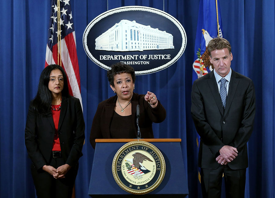 U.S. Attorney General Loretta Lynch (center) speaks during a press conference at the Department of Justice December 7, 2015 in Washington, DC. Image credit: Win McNamee/Getty Images/WBUR