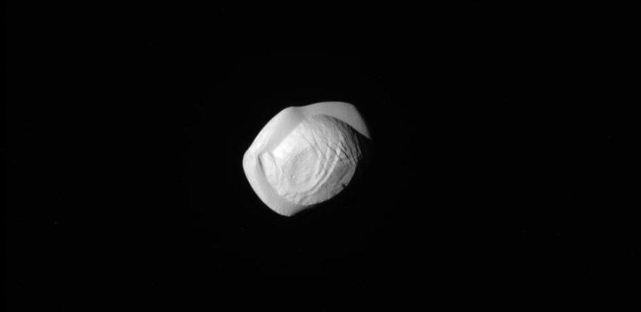 Pan is the second innermost of Saturn’s known moons. Image credit: NASA / JPL-Caltech, via Space Science Institute / The New York Times