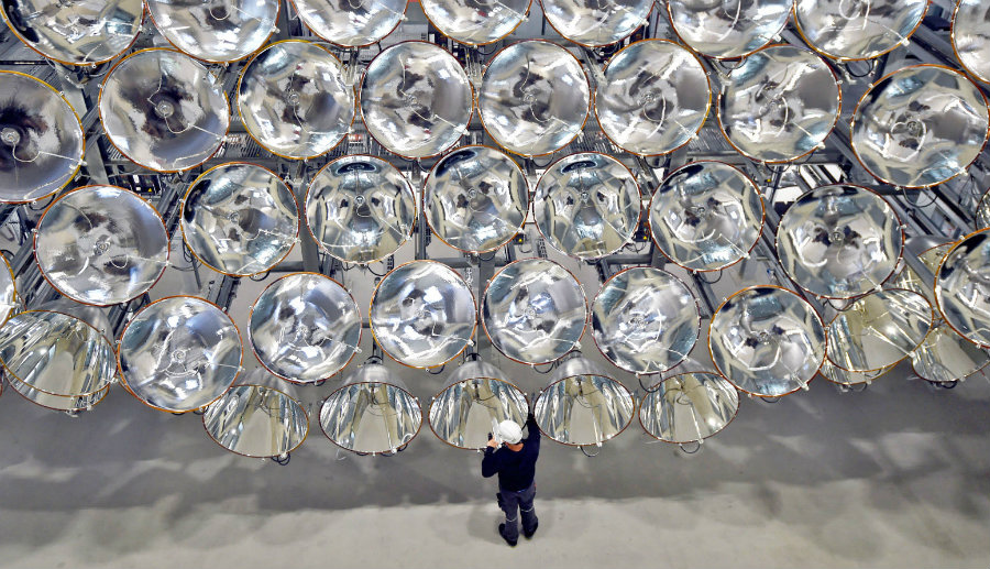 Synlight resides in Juelich, Germany, and it is a 45-feet-high honeycomb-shaped array of 149 xenon lamps. Image credit: Barcroft Media via Getty Images / Engadget