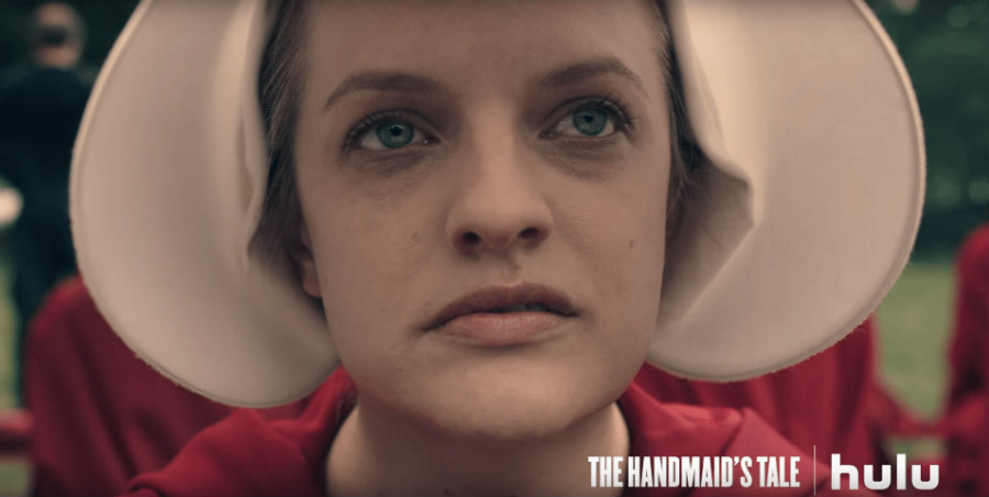 The Handmaid'sTale is a dystopian novel that narrates the story of Offred, a handmaiden living in a patriarchal and totalitarian America. Image credit: Hulu via Youtube / MPR News