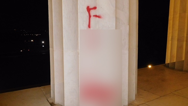 A blurred photo of the graffiti left on the Lincoln Memorial early Tuesday, August 15, 2017. Image Credit: National Park Service