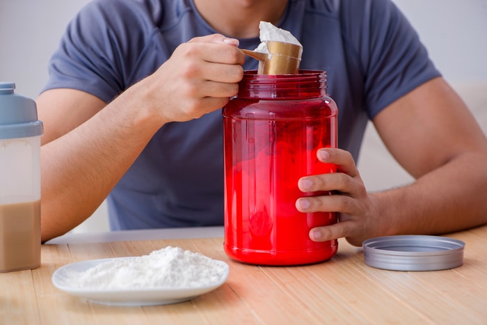 Athlete Consuming Protein Powder