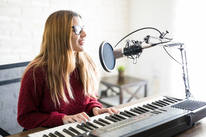 Woman Singing Song Playing Piano