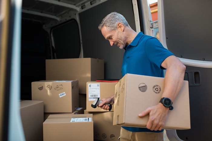 Delivery Man Scanning Box