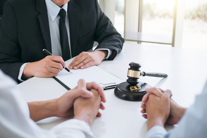 Lawyer Signing Documents