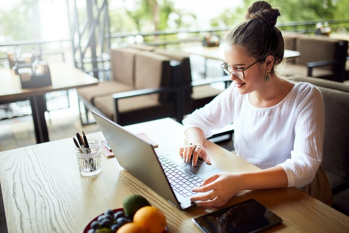 Academic Woman Typing on Laptop