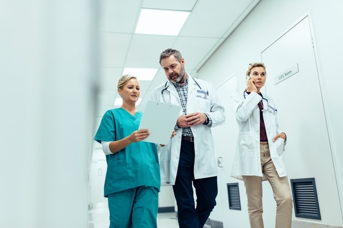 Doctors Walking in Hospital Corridor