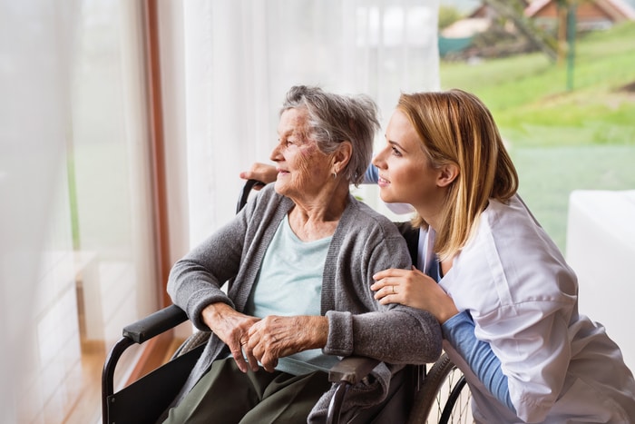 Nurse Helping Elderly Woman